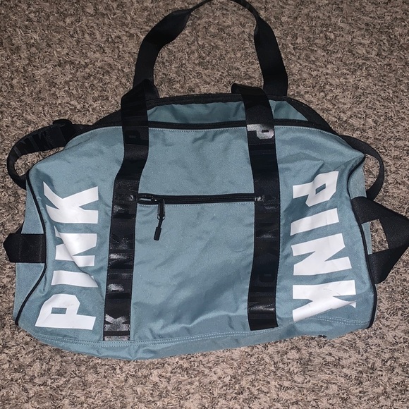 PINK Victoria's Secret Handbags - PINK Victoria’s Secret duffel bag in blue with black straps